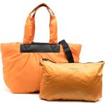 Bolsos naranja de piel acolchados de materiales sostenibles para mujer 