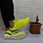 Zapatillas amarillas de fútbol para mujer 