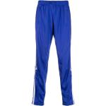 Pantalones estampados azules de poliester rebajados con logo adidas de materiales sostenibles para hombre 