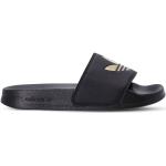 Sandalias planas negras de PVC con logo adidas Adilette para mujer 