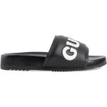 Sandalias negras de goma de cuero con logo Gucci para hombre 